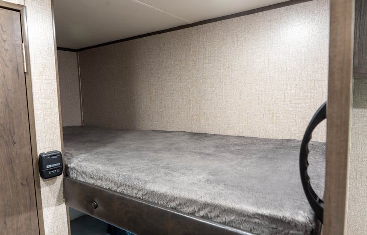 Upper Bunk: NO Outlet. Includes Light