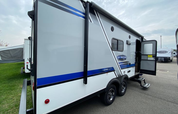 drop down steps with screen door and locking front door, retractable awning, with lights