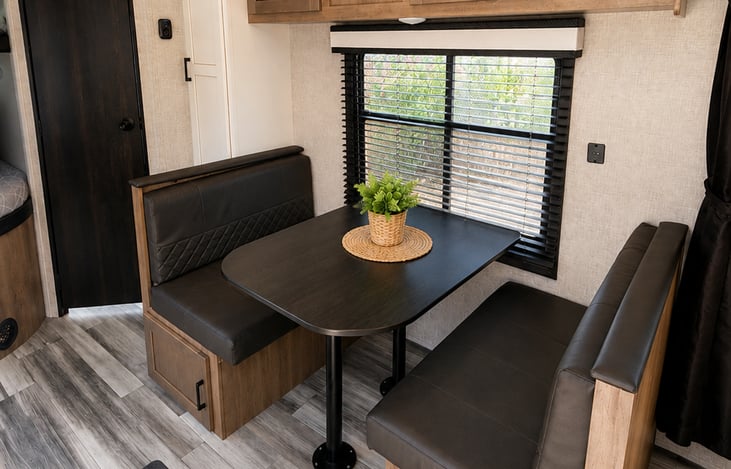 Comfortable booth dinette with seating for family meals, game night, or trip planning. Converts into additional sleeping space when needed. Also extra storage space.