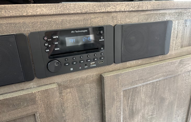 Entertainment system. Has indoor and outdoor speakers. DVD/CD player, AM/FM radio, and bluetooth hookup.