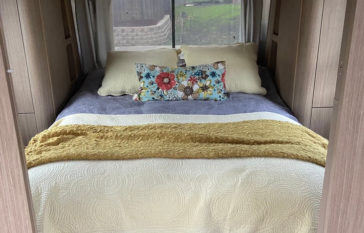 Queen bed in the main bedroom.