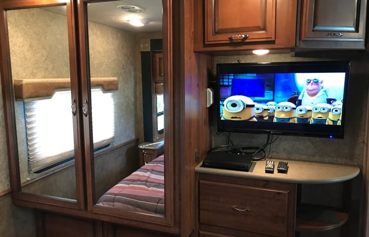 32" TV with DVD Player.  Double door wardrobe area with mirrors.