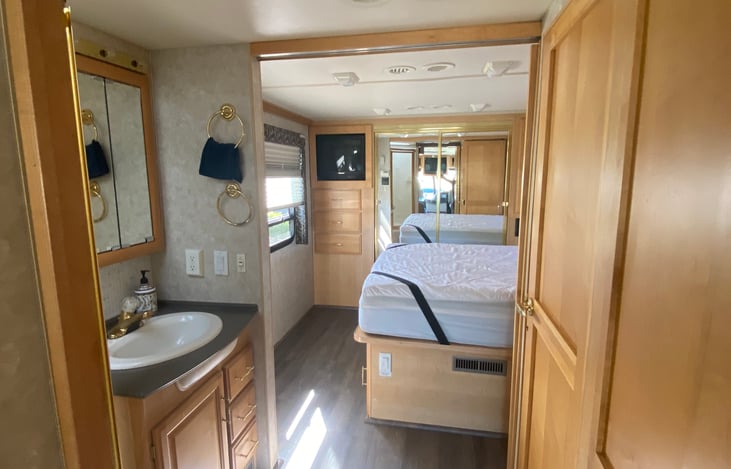 Back section of RV. Bathroom and bedroom area.