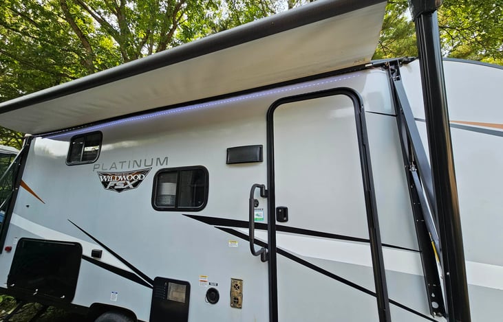 Awning partially open to show the LED's for late night hangs. Bottom left (black door) is where the outdoor griddle and mini fridge are.
*Awning currently unusable 6/10/24*