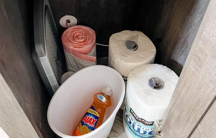 Included dish soap, 2 paper towel rolls, trash bags & kitchen garbage can.