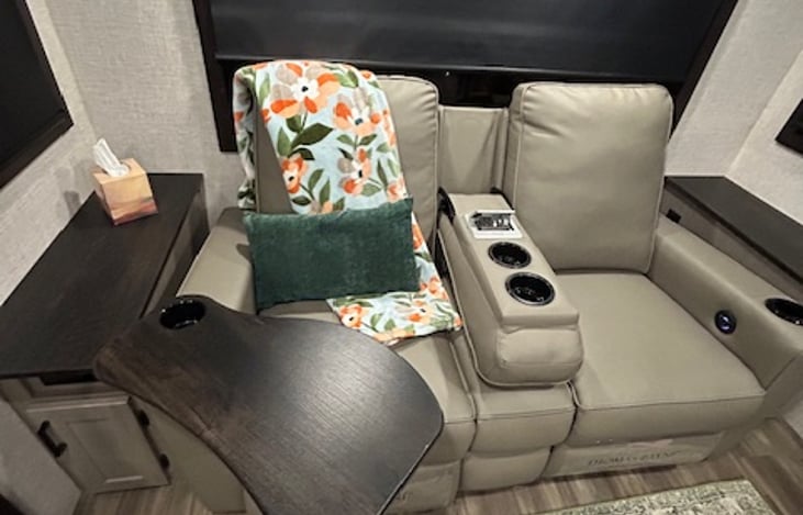 Convenient removable TV trays attach to recliners for dining or working from your seat.