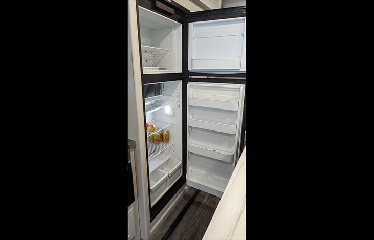 Roomy refrigerator and freezer. It can run on either electric or propane.