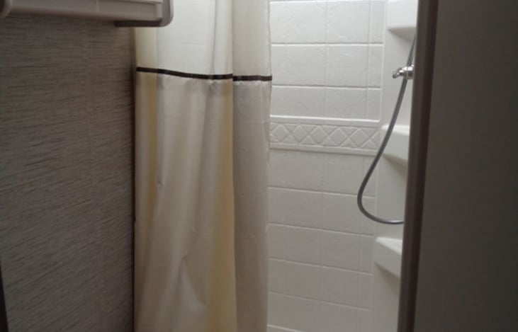 A decent size shower with on demand hot water heater.