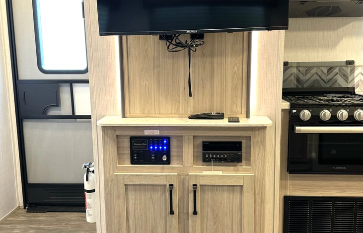 TV, stereo, DVD Player and unit control panel.