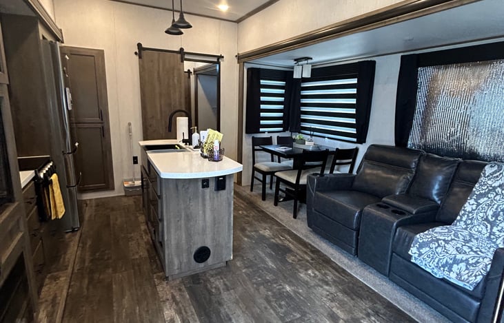 Reclining Sofa with power seats
5 pc dinette
Island sink and counter space
Residential size refrigerator, range and microwave