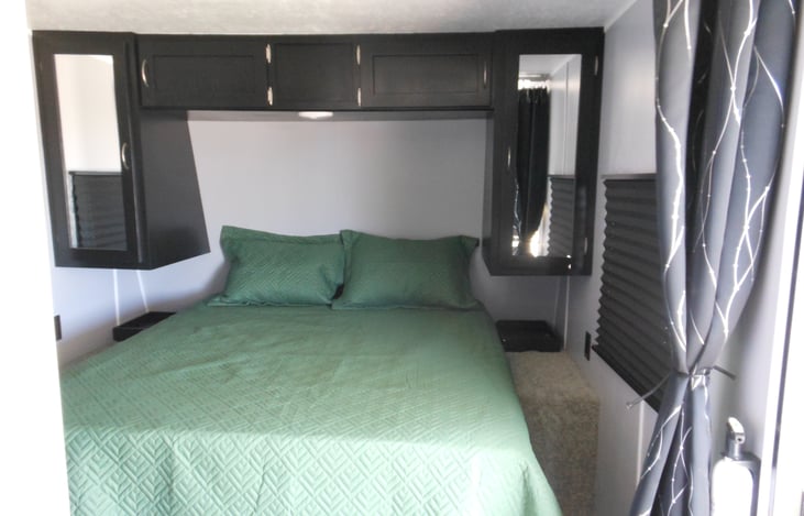 New queen hybrid mattress with all new linen. Plenty of overhead storage.