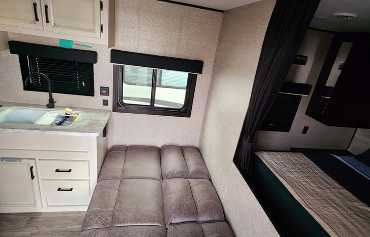 Foldout couch transforms into a comfortable bed and has storage underneath.