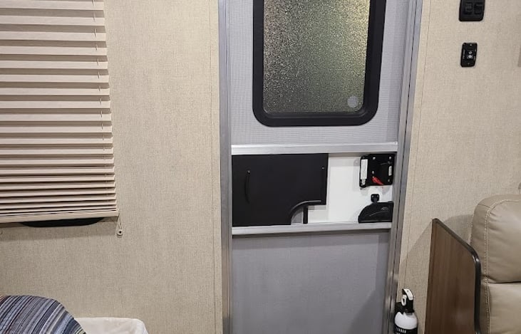 Front door and fire extinguisher.  Interior and exterior rug included, as well as broom/dust pan.