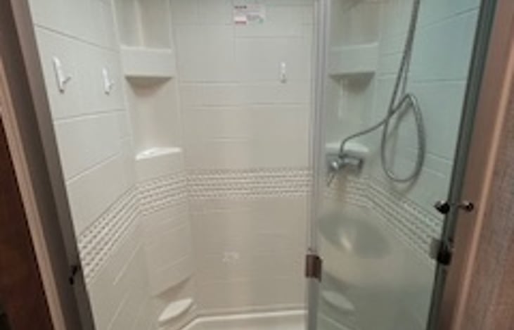 Full size shower accommodates most tall & chunky folks!