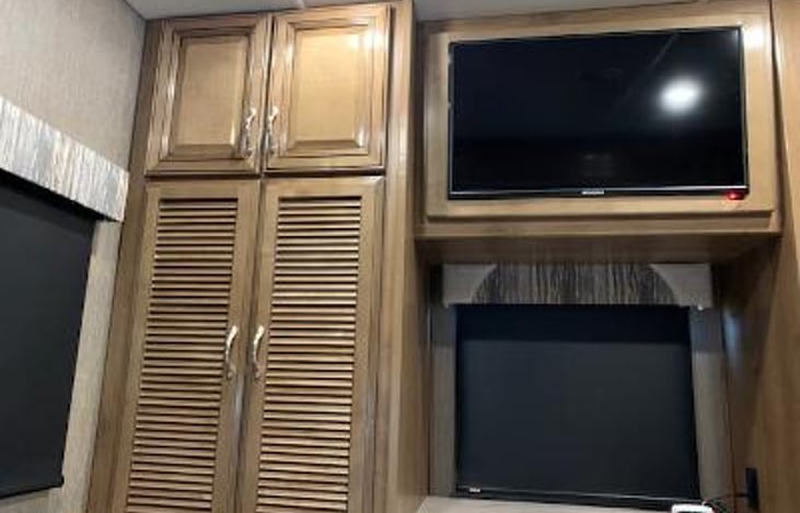 Bedroom storage & TV with storage behind.