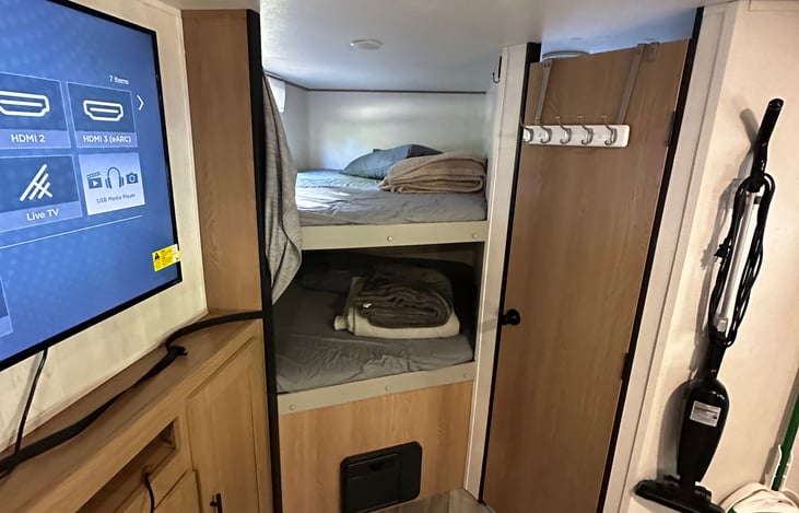 two bunkbeds with pillow, sheets, and blankets supplied.