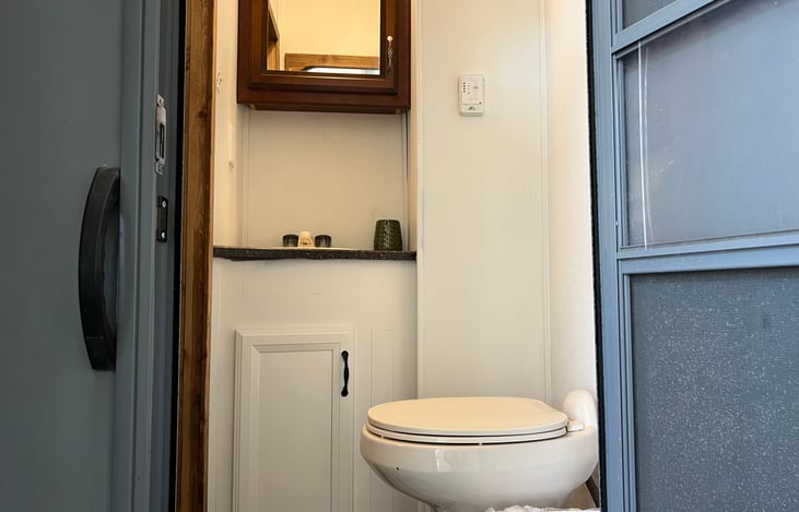 Bunkhouse bathroom with outside access