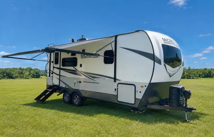 "Micro Easy" is a premium, lightweight, single-slide travel trailer explicitly optimized as a luxury couple's coach that features high-end structural choices uncommon in typical lightweight units.