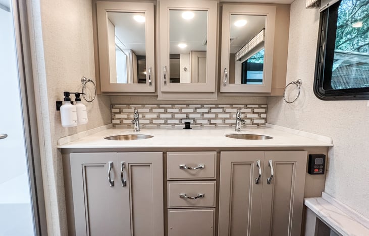 Spa-like bathroom with modern fixtures and plenty of storage