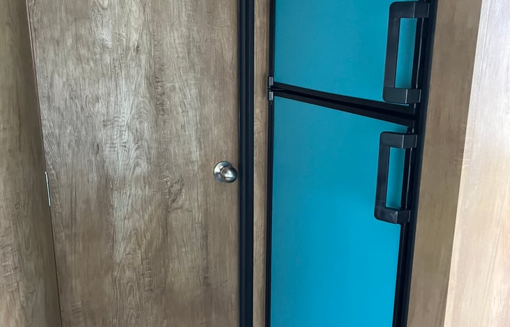 Teal vintage style fridge gives off a fun and simple vibe!