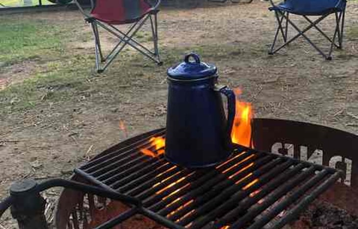Percolate your coffee over the campfire, or choose to use the automatic drip coffeemaker or the Keurig (with starter supply of coffee pods)
