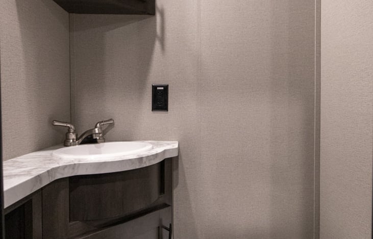 2nd Bathroom located in garage. Half bath with toilet & sink.