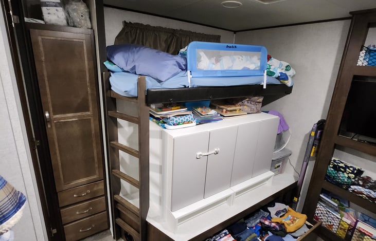 Bunk room bed and storage.