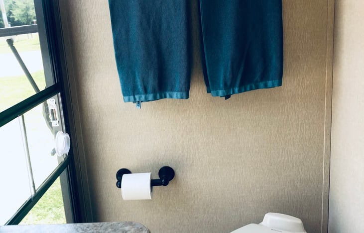 2nd door bathroom entrance,
very convenient when camping, shower, vanity with mirror/storage above, camping TP and towels provided...