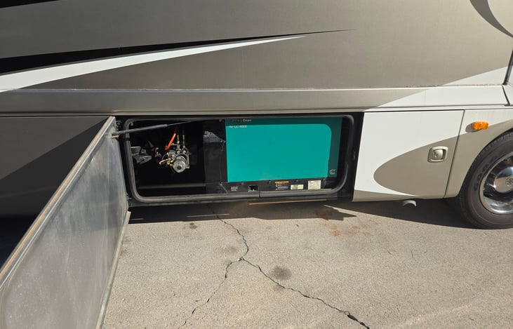 6000 W diesel generator 30 amps for while you travel. Runs off the diesel that is in the gas tank. The generator will automatically cut off when down to a quarter of a tank