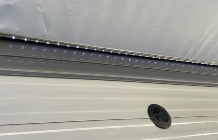 LED light for our super size power awning and outdoor speakers
