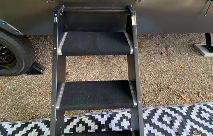 Steps into (and out of) the camper.