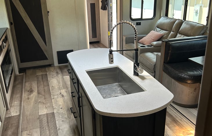 Spacious galley and fully-equipped kitchen. Plenty of room for everyone. Private bunkhouse and private bedroom on opposite ends. Pop-up TV to keep everyone entertained. Ample storage.