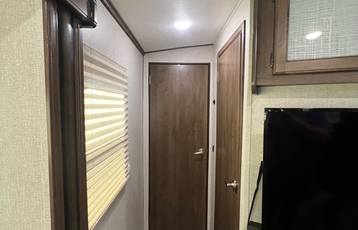 Hall to bathroom and main bedroom suite