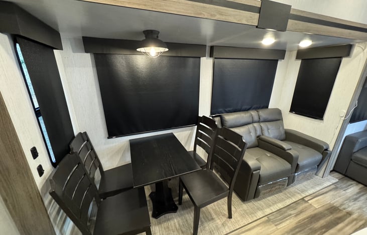 Dining table and two seat recliner.