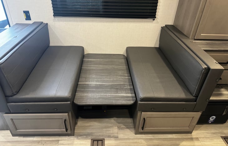 Dinette breaks down into a bed.