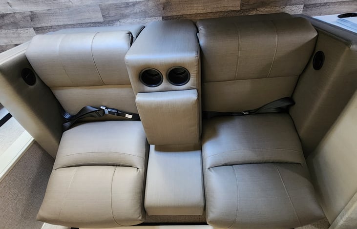 Comfortable reclining chairs with cupholders and remote/accessory storage in the middle. Great for kicking back and relaxing or a full snooze  :,)