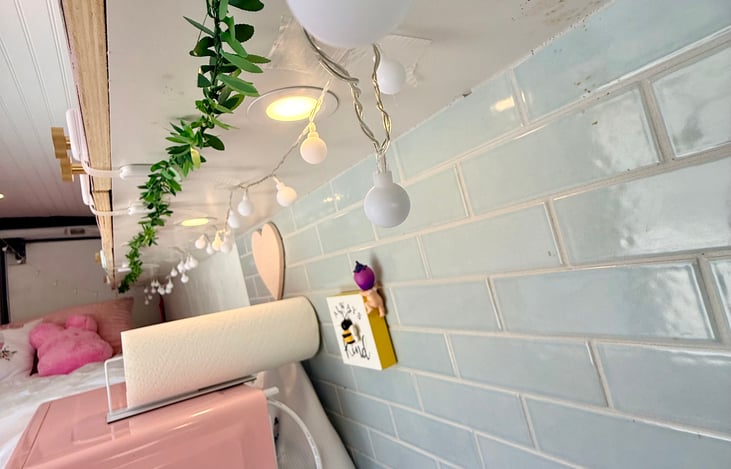 Under cabinet and ceiling lighting create a warm, inviting atmosphere and provide convenient illumination throughout the space. Runs on Solar.