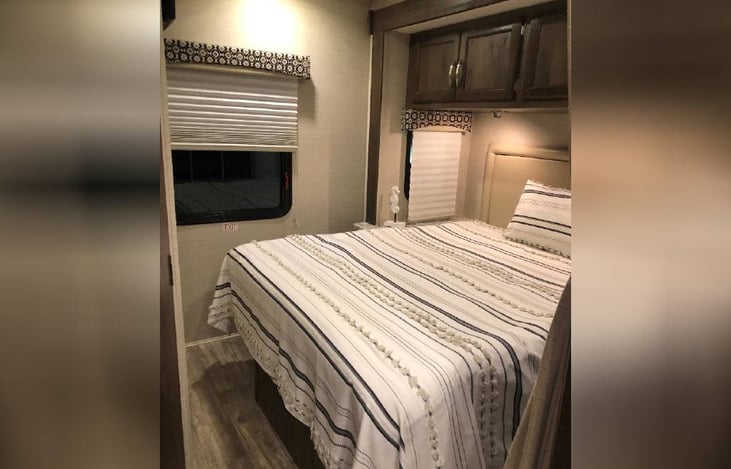 Master bedroom: includes a tv, personal closet, lots of storage and is easily navigated with ample space on either side of the bed.