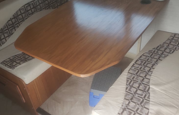 New Table Upgrade using solid wood. Folds down for bed area for 2 small kids or one adult under 5 foot 10 inches
