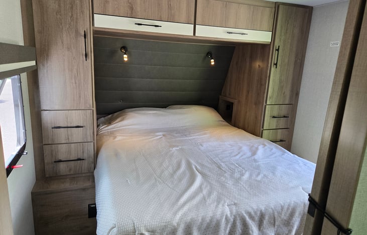 Upgraded full queen size mattress for the best night's rest possible, plus storage above and below the bed, and a private exterior door.