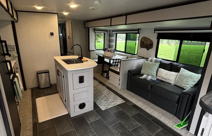 Farm style sink with kitchen Island. Sofa pulls out to a full size bed. Kitchen table converts to a bed as well.