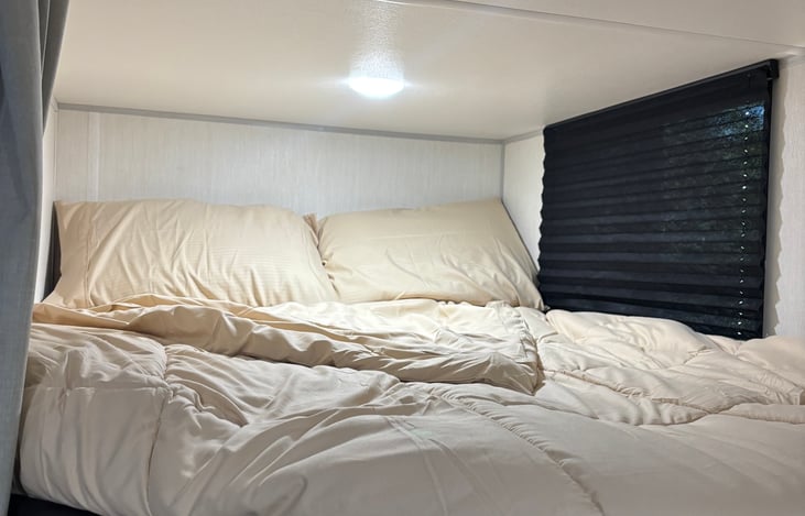 top full bunk with window and outlet
