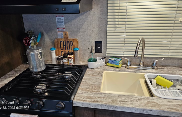 Kitchen area comes with all this plus an electric coffee pot.