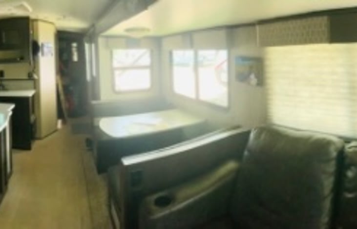 Spacious living room looking towards the hallway to the bedroom and bathroom.