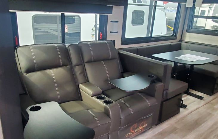 Recliners lay completely back to offer another space for guests to sleep.   Dinette table lowers to have cushions lay out and make up guest bed.