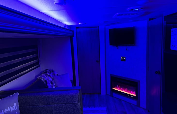 Living area with fireplace and TV