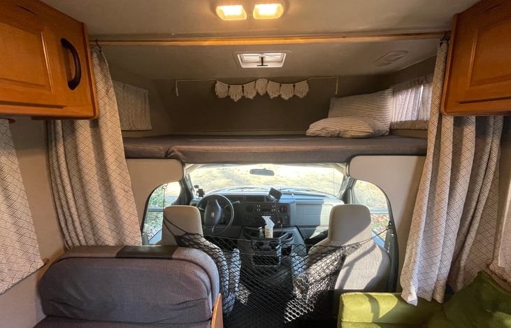 Safety net for dogs prevents dogs from entering into the cab space.