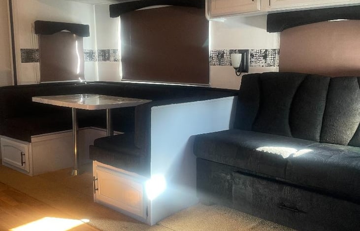 both the booth and sofa convert to beds