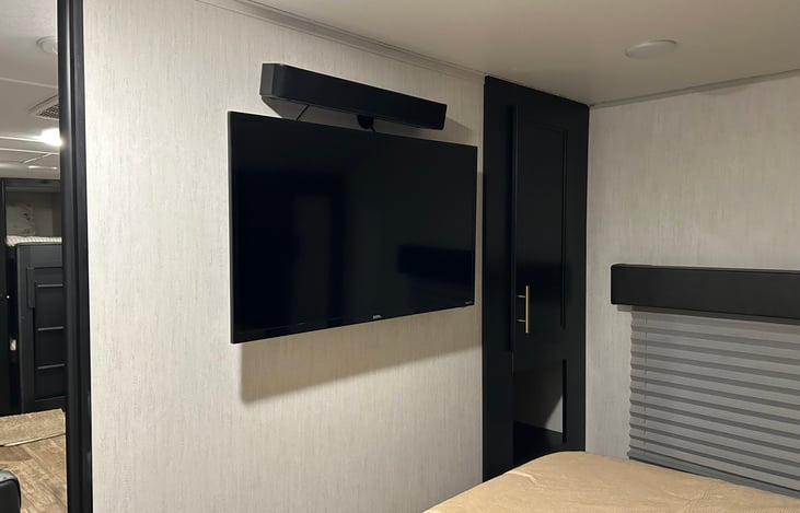 Private bedroom smart tv and sound bar.
