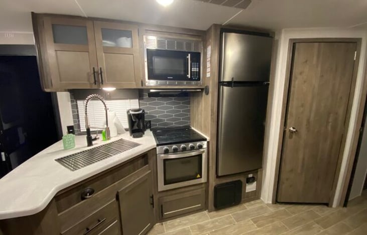 indoor kitchen/ door to half bath